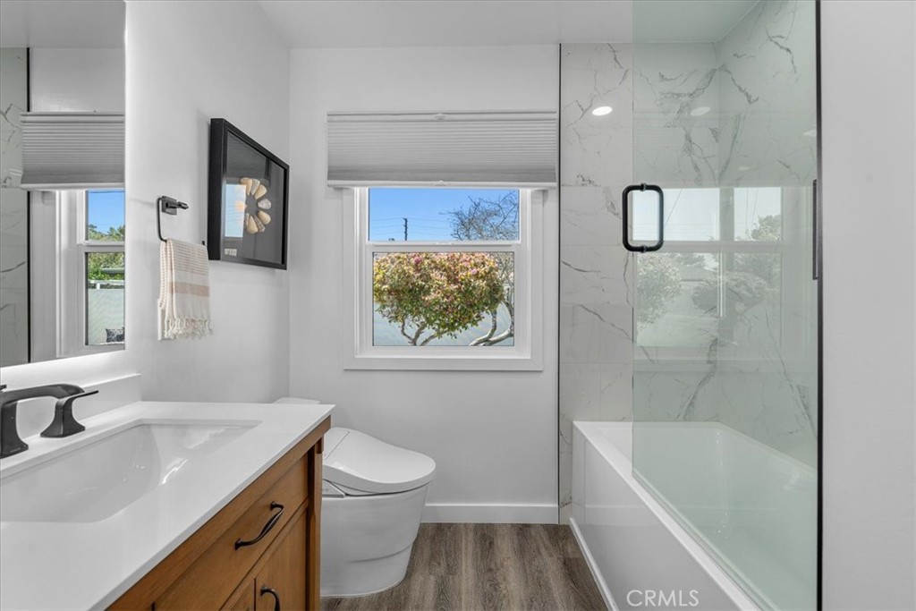 15519 Roselle Avenue Lawndale, CA 90260 - Photo 17 of 28 a bathroom with a sink a toilet and bathtub