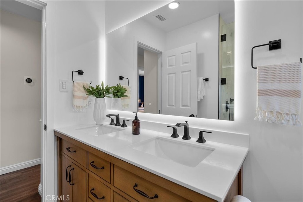 15519 Roselle Avenue Lawndale, CA 90260 - Photo 19 of 28 a bathroom with double sink and a mirror