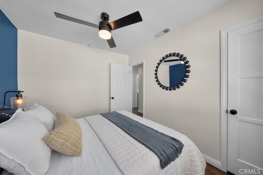 15519 Roselle Avenue Lawndale, CA 90260 - Photo 22 of 28 a bedroom with a bed and a chandelier