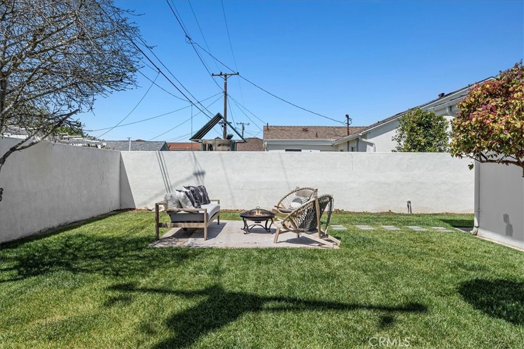 15519 Roselle Avenue Lawndale, CA 90260 - Photo 27 of 28 a view of a backyard with chair and table