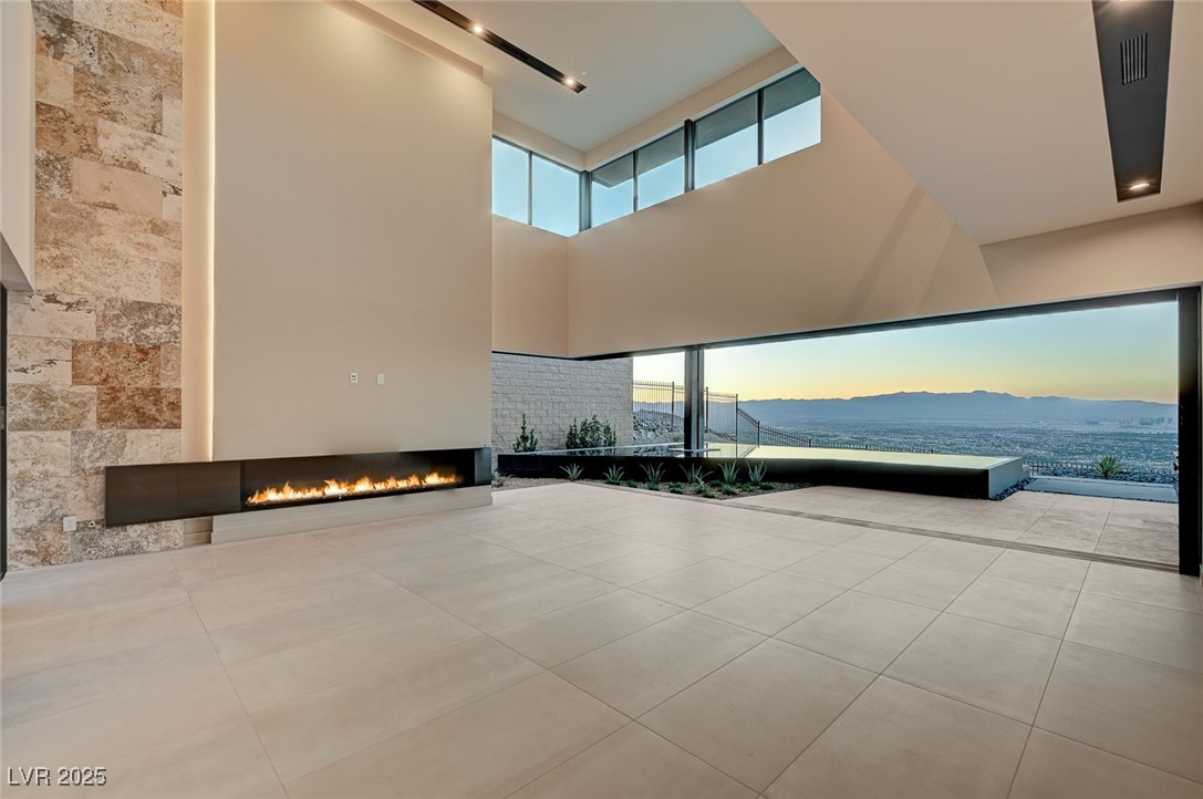 607 Grand Rim Drive Henderson, NV 89012 - Photo 13 of 30 Common area featuring a towering ceiling and a mountain view