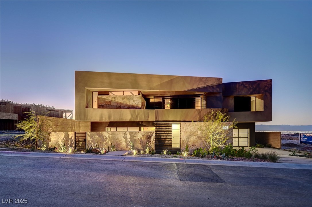 607 Grand Rim Drive Henderson, NV 89012 - Photo 2 of 30 View of front of house featuring stucco siding