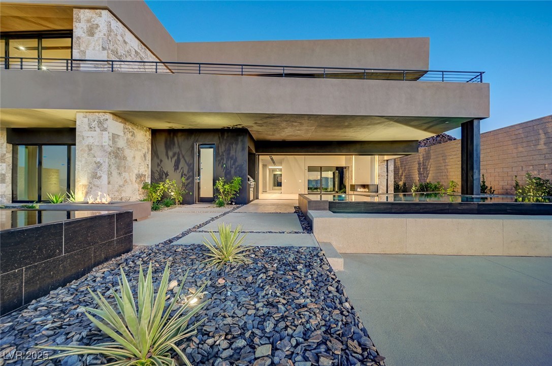 607 Grand Rim Drive Henderson, NV 89012 - Photo 23 of 30 Back of property with stone siding