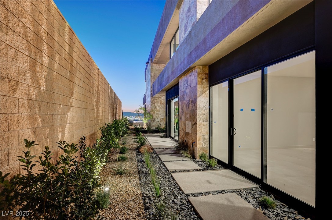 607 Grand Rim Drive Henderson, NV 89012 - Photo 27 of 30 View of side of home featuring stone siding