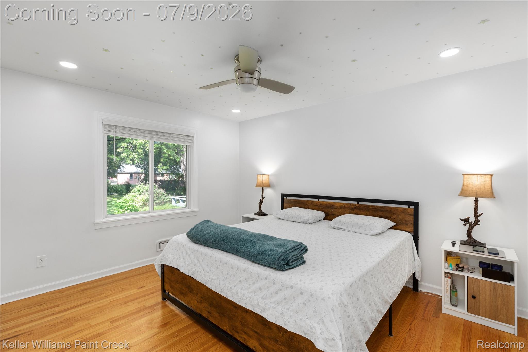 2731 Crooks Road Royal Oak, MI 48073 - Photo 7 of 34 Spacious room with wood-finish flooring and a white color palette