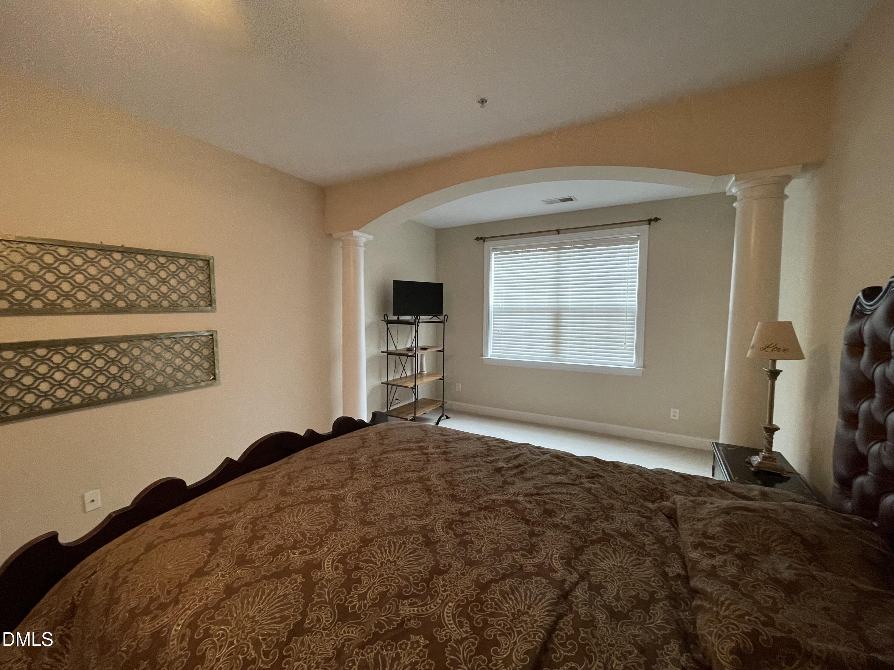 10411 Rosegate Court, Unit 3 Raleigh, NC 27617 - Photo 27 of 62 a bedroom with a bed and a window