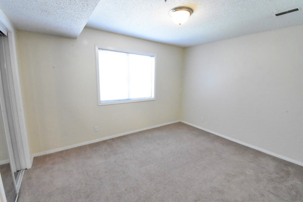 1330 Brook Street, Unit M St. Charles, IL 60174 - Photo 5 of 11 an empty room with a window