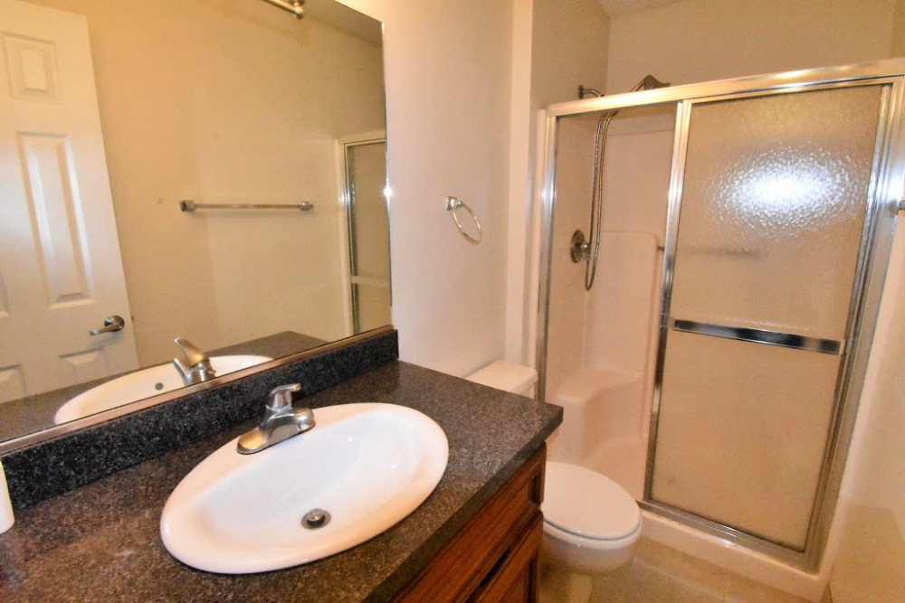 1330 Brook Street, Unit M St. Charles, IL 60174 - Photo 6 of 11 a bathroom with a sink and a mirror