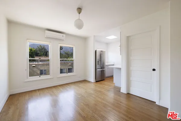 a kitchen with stainless steel appliances a refrigerator sink and microwave