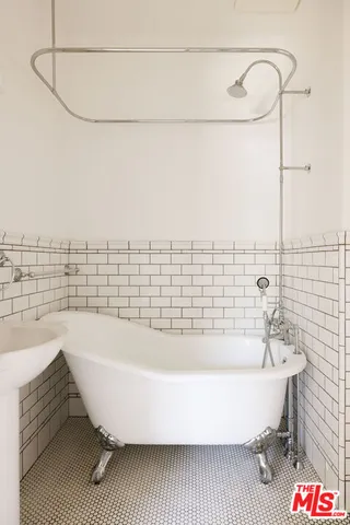 a view of staircase with wooden floor and a rug