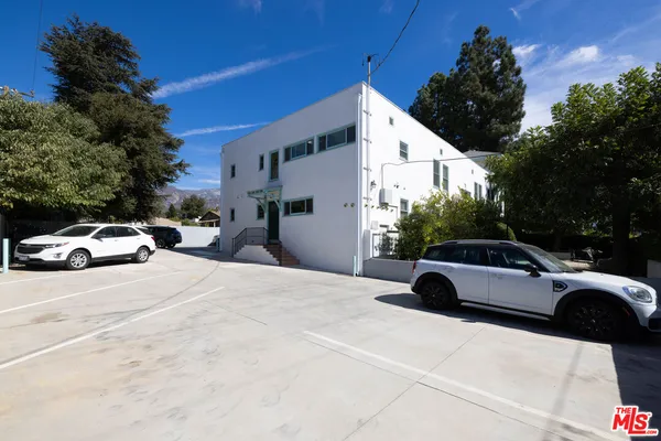 a view of a street with parking