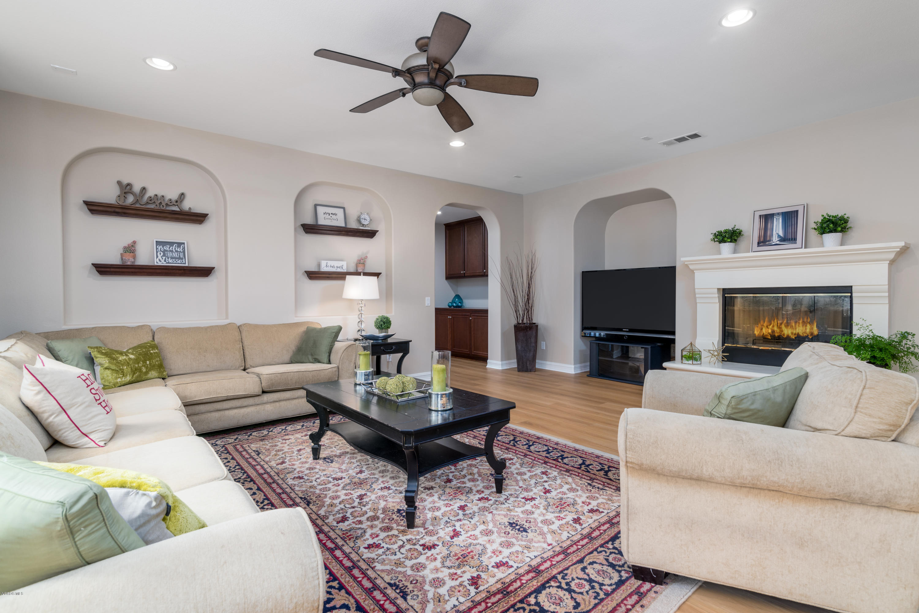 310 Spring Park Road Camarillo, CA 93012 - Photo 16 of 48 a living room with furniture a flat screen tv and a fireplace