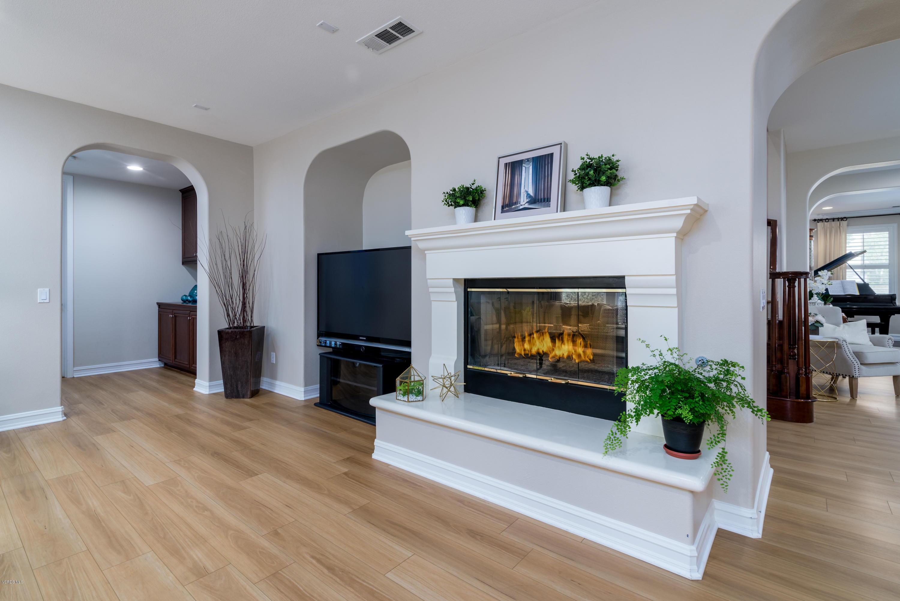 310 Spring Park Road Camarillo, CA 93012 - Photo 17 of 48 a living room with furniture a fireplace and a flat screen tv