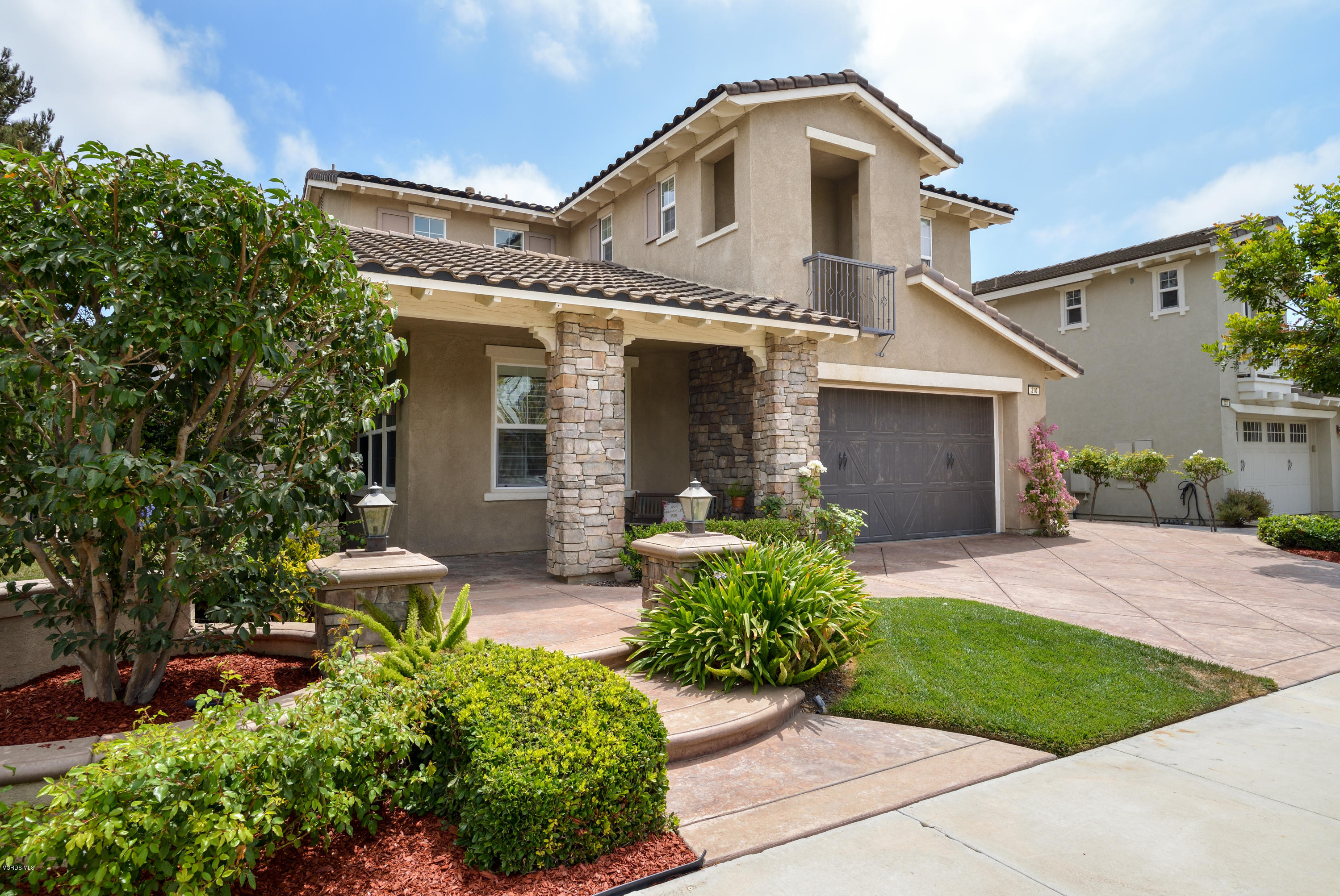 310 Spring Park Road Camarillo, CA 93012 - Photo 3 of 48 a front view of a house with garden