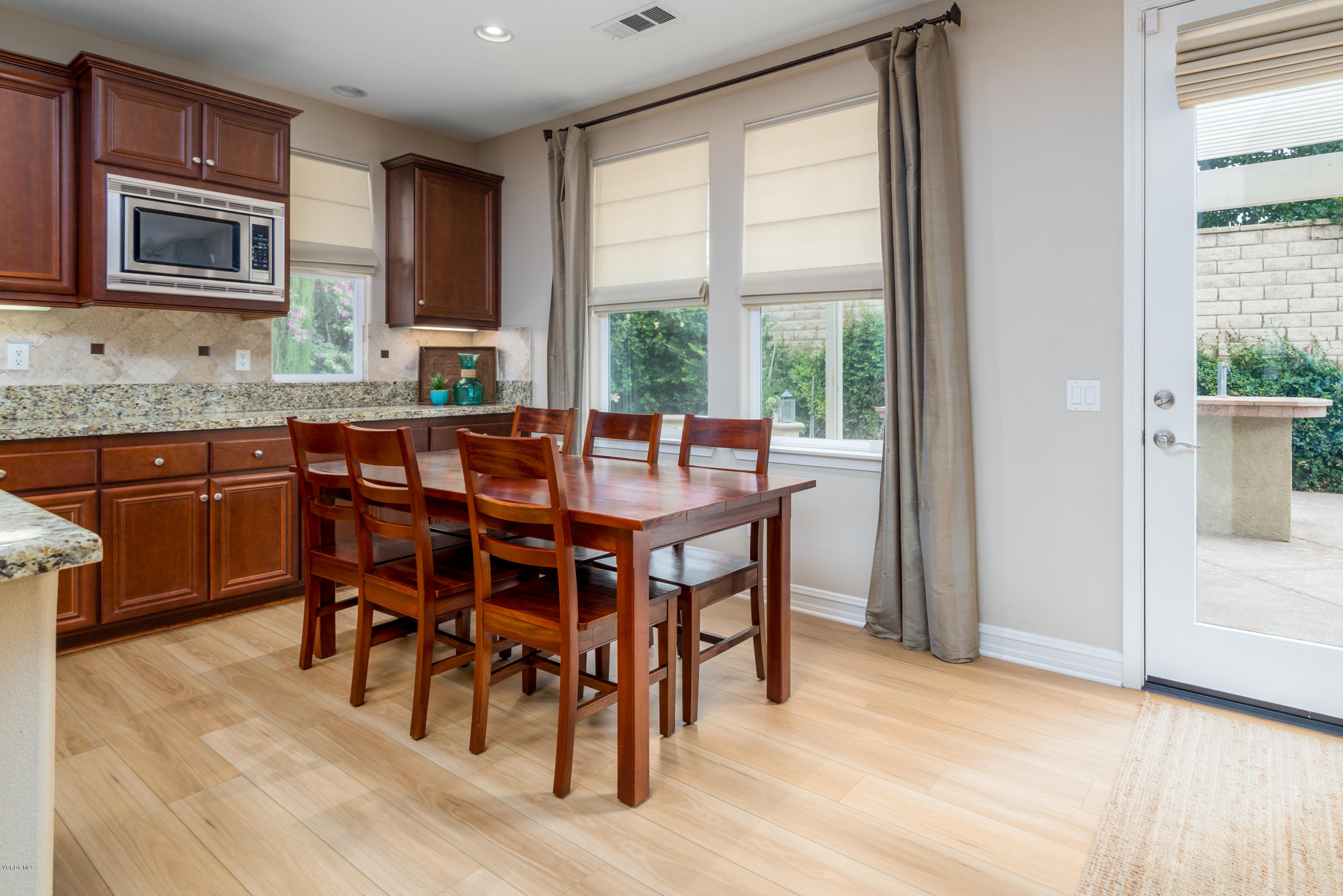 310 Spring Park Road Camarillo, CA 93012 - Photo 24 of 48 a view of a dining room with furniture window and wooden floor