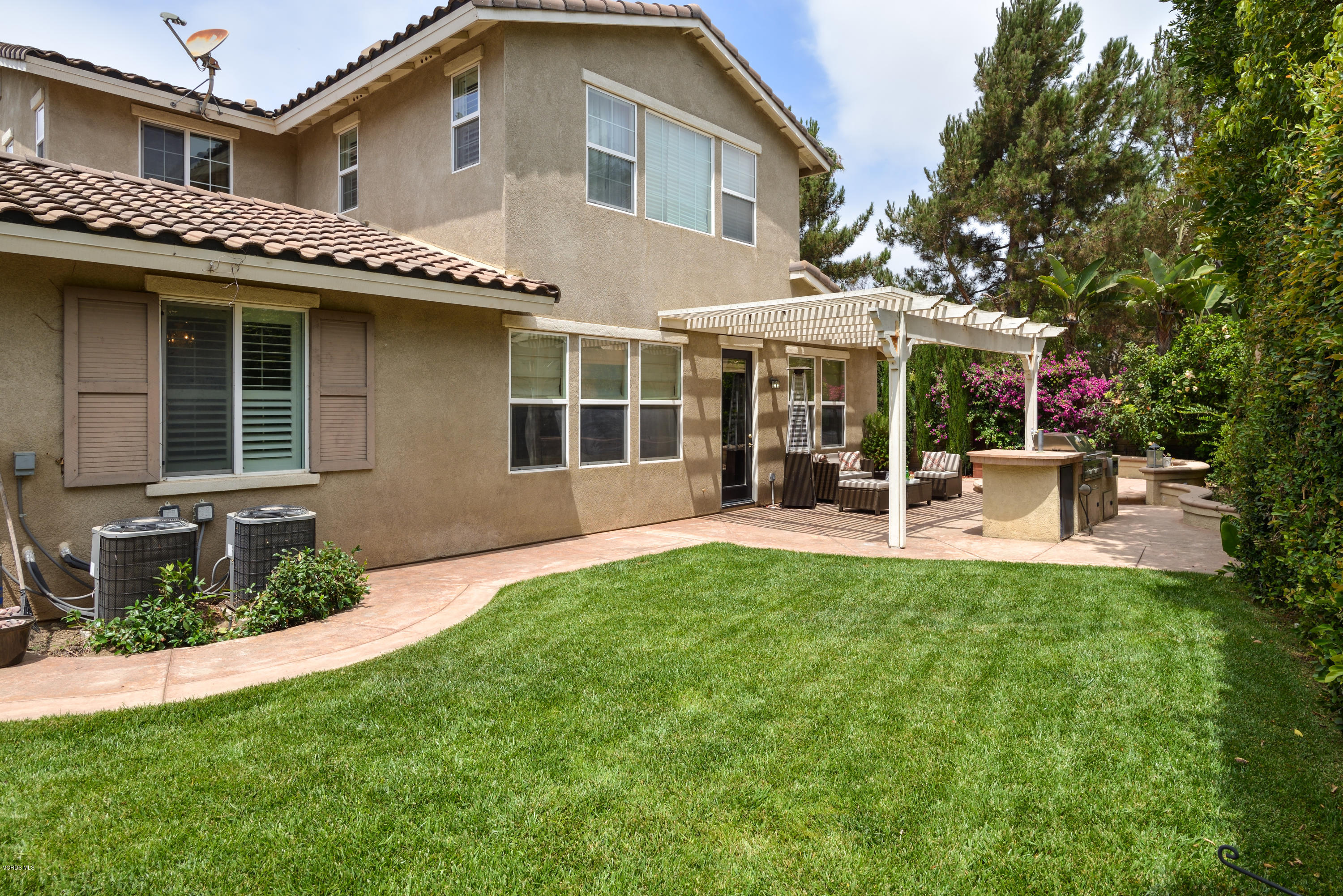 310 Spring Park Road Camarillo, CA 93012 - Photo 4 of 48 a view of a house with a backyard and a patio