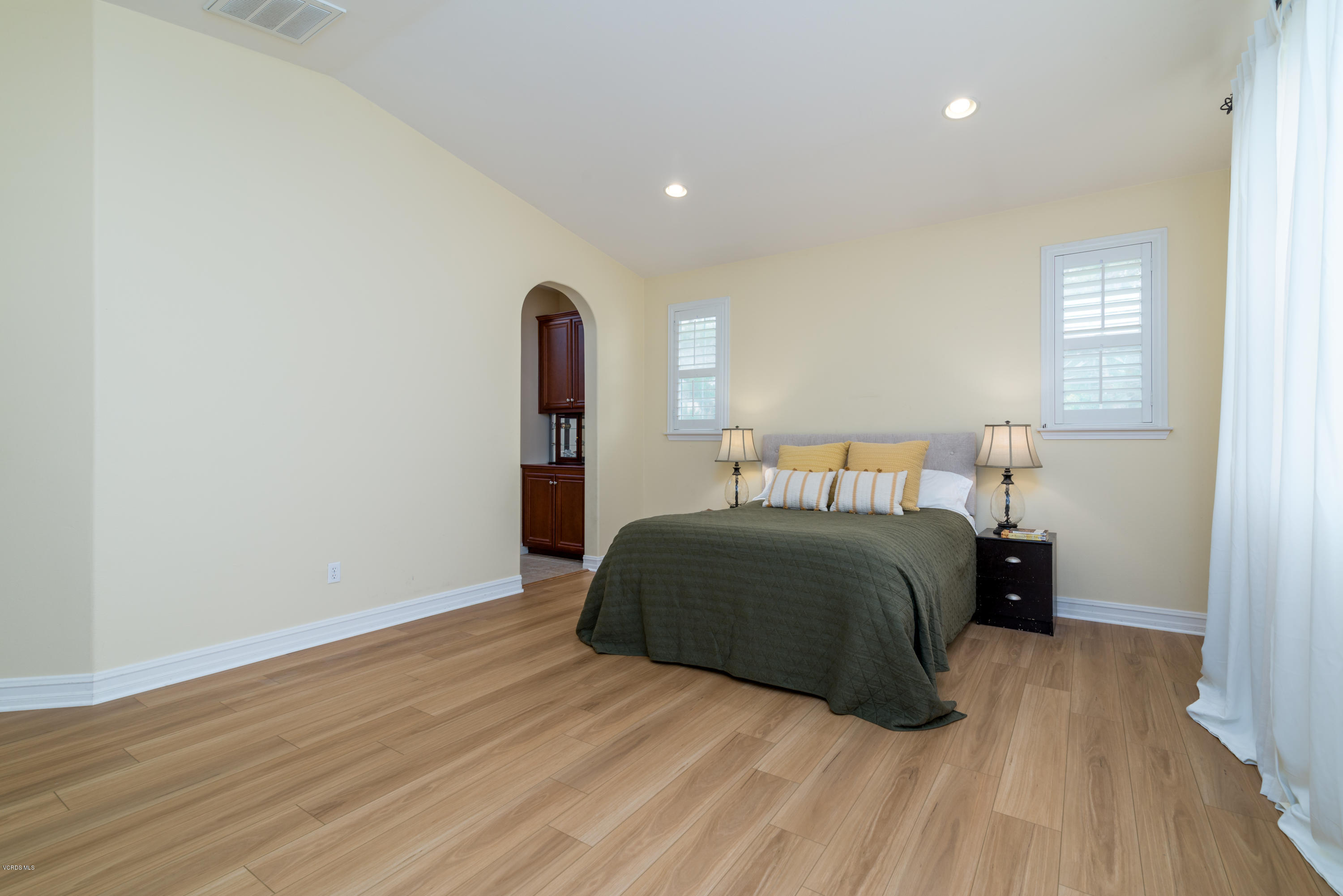 310 Spring Park Road Camarillo, CA 93012 - Photo 39 of 48 a bedroom with a bed and wooden floor