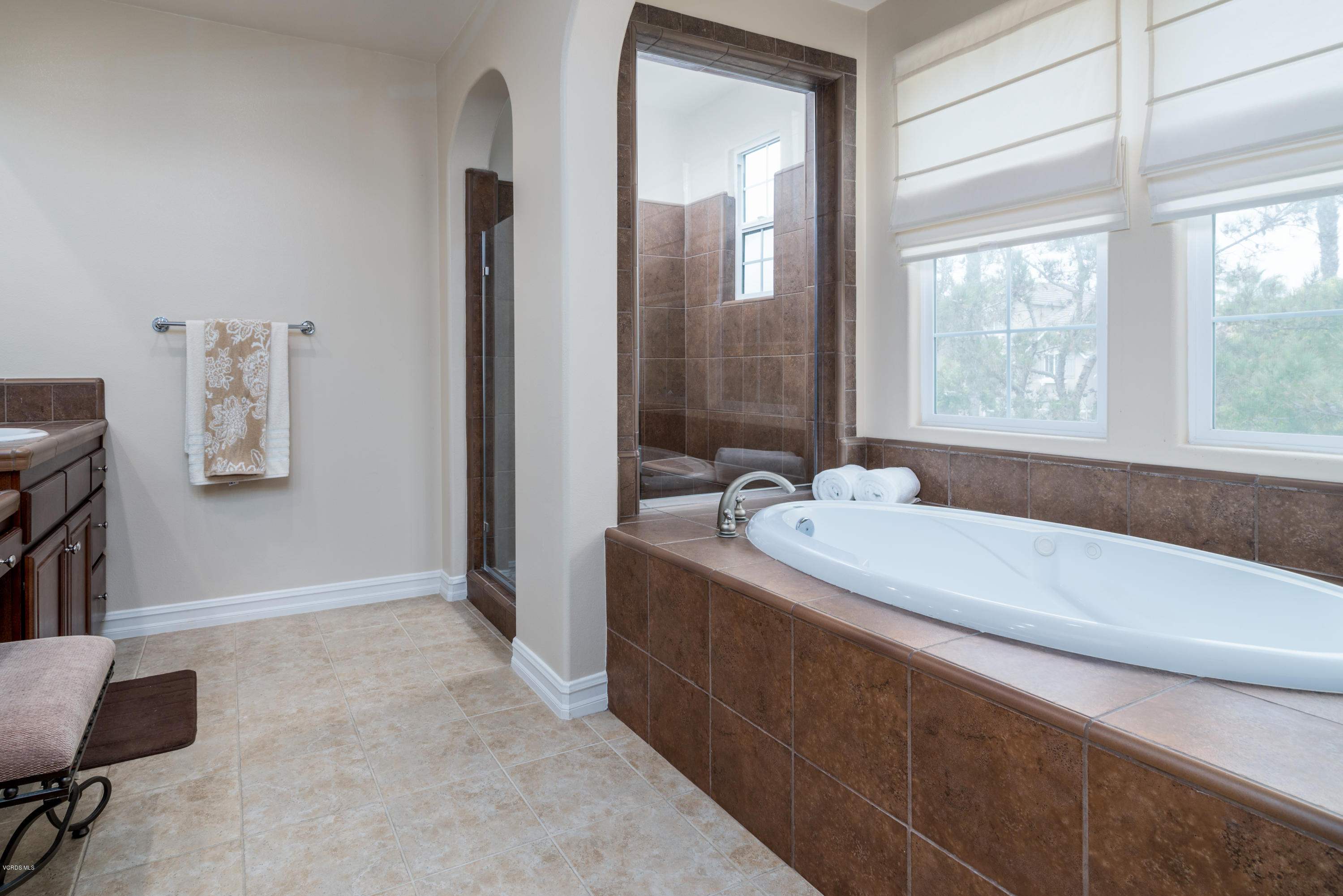 310 Spring Park Road Camarillo, CA 93012 - Photo 42 of 48 a bathroom with a granite countertop sink and a bathtub