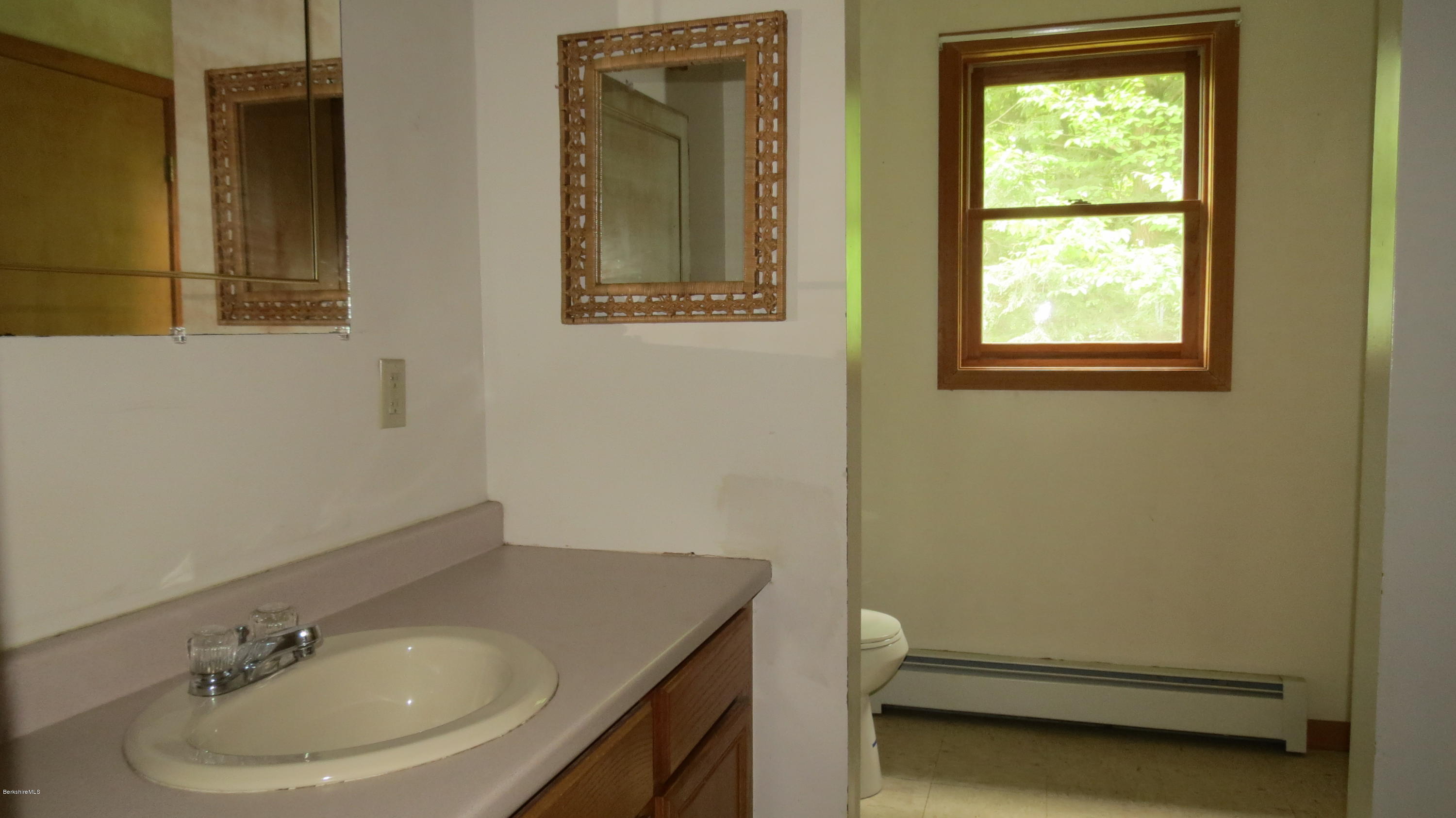 116 East Hawley Road Hawley, MA 01339 - Photo 9 of 29 a bathroom with a sink and a window
