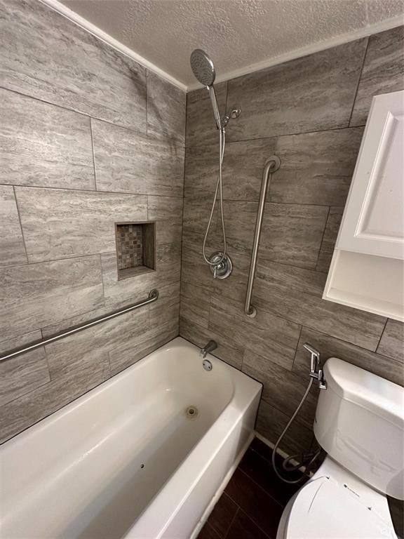 15221 Berry Trail, Unit 1003 Dallas, TX 75248 - Photo 13 of 17 a bathroom with a toilet and a shower