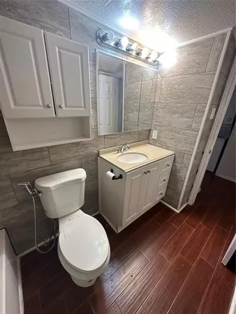 a bathroom with a toilet and a sink