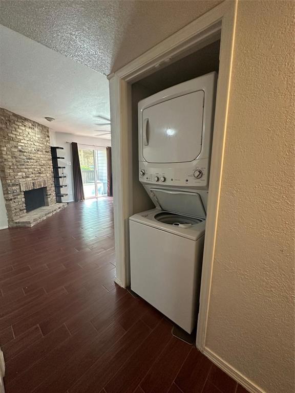 15221 Berry Trail, Unit 1003 Dallas, TX 75248 - Photo 17 of 17 a room with wooden floor washer and dryer
