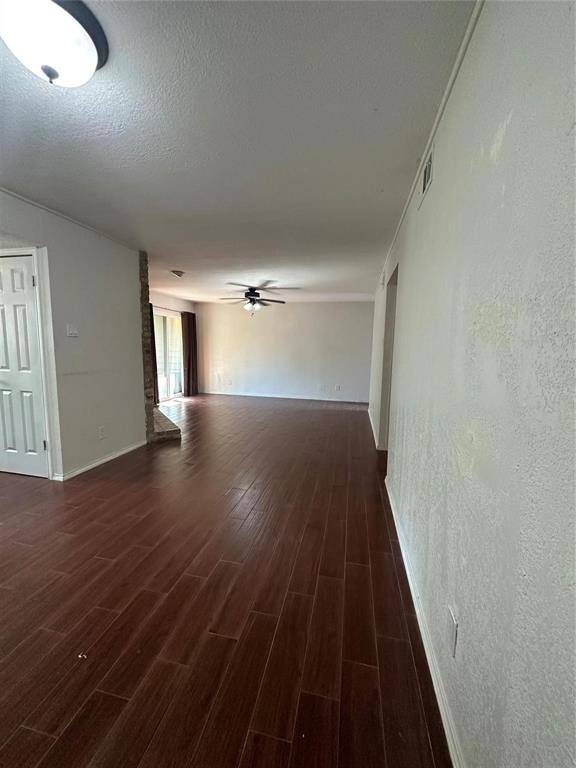 15221 Berry Trail, Unit 1003 Dallas, TX 75248 - Photo 3 of 17 a view of empty room with wooden floor