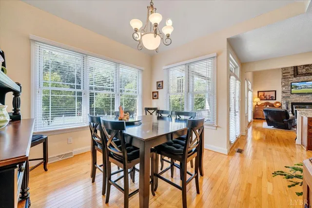 a bathroom with a granite countertop sink a toilet and a mirror