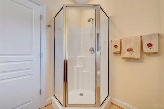 a aerial view of a house with swimming pool lawn chairs and a yard