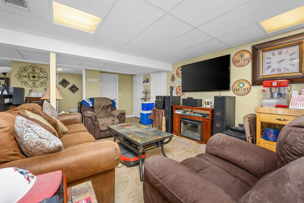 138 Sprague Street Fall River, MA 02724 - Photo 20 of 34 a living room with furniture and a flat screen tv