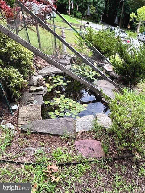 171 Silver Lake Drive Clementon, NJ 08021 - Photo 19 of 25 a view of a wooden bridge with a yard