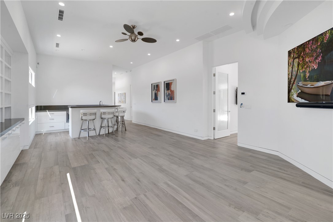 10 Ridge Blossom Road Las Vegas, NV 89135 - Photo 22 of 69 Living room with light wood-style floors, recessed lighting, and ceiling fan