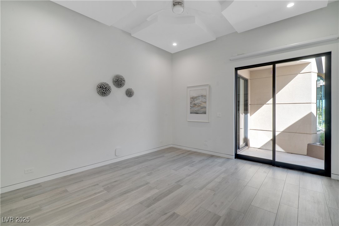 10 Ridge Blossom Road Las Vegas, NV 89135 - Photo 39 of 69 Spare room featuring light wood finished floors and a ceiling fan