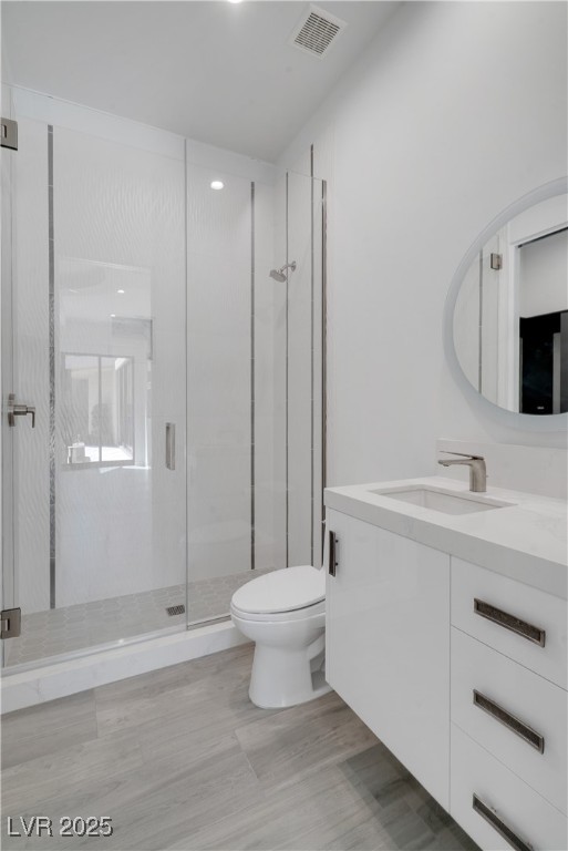 10 Ridge Blossom Road Las Vegas, NV 89135 - Photo 43 of 69 Full bath featuring a shower stall, vanity, and light wood-style floors