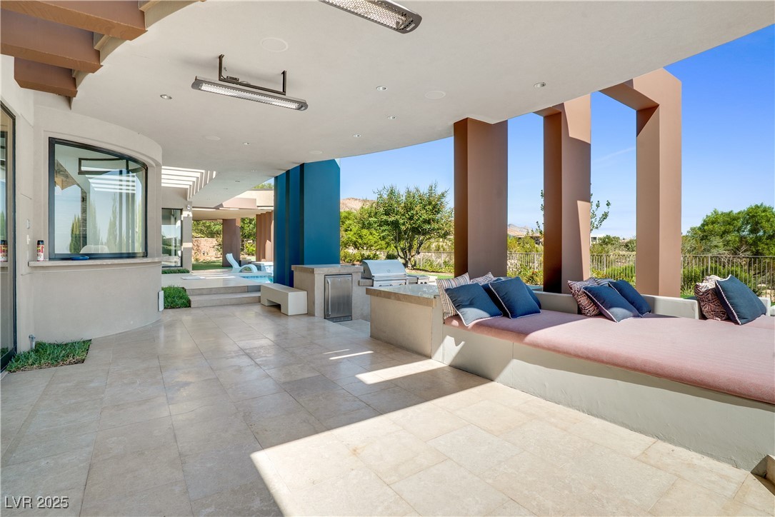 10 Ridge Blossom Road Las Vegas, NV 89135 - Photo 54 of 69 View of patio / terrace featuring an outdoor kitchen