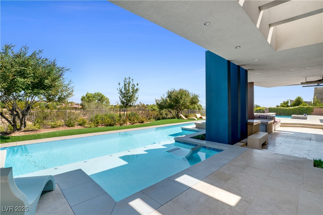 10 Ridge Blossom Road Las Vegas, NV 89135 - Photo 60 of 69 View of swimming pool with a fenced backyard, a patio, and a jacuzzi