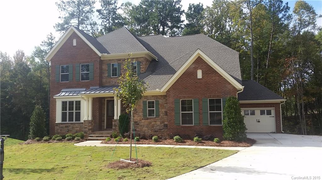 720 Chase Court, Unit 123 Fort Mill, SC 29708 - Photo 2 of 19 a front view of a house with a yard