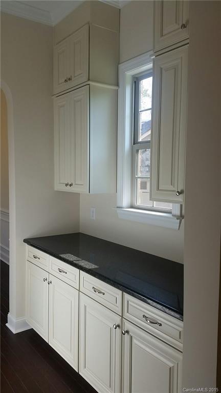 720 Chase Court, Unit 123 Fort Mill, SC 29708 - Photo 6 of 19 a kitchen with granite countertop white cabinets and white appliances
