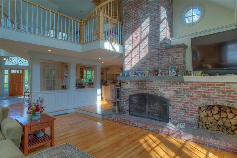 500 Elliott Road Centerville, MA 02632 - Photo 8 of 35 a living room with furniture a flat screen tv and a fireplace