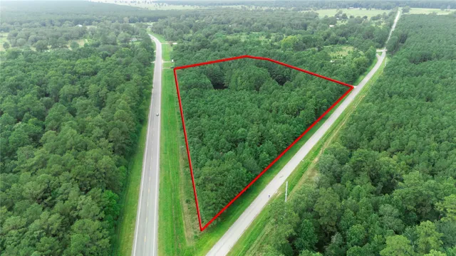 a view of a back yard from a balcony