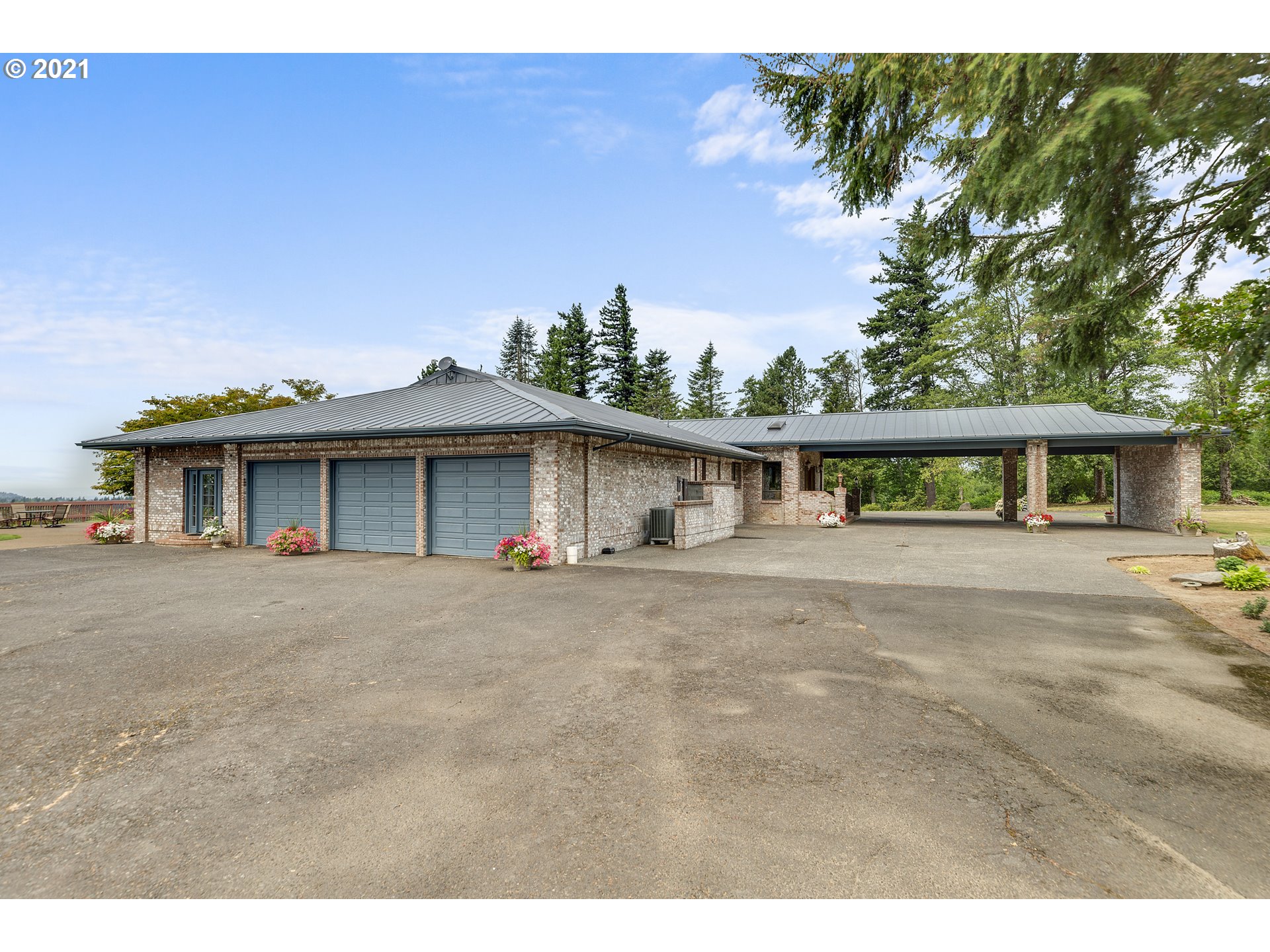 201 Northeast Salzman Road Corbett, OR 97019 - Photo 1 of 32 a front view of a house with a yard and garage