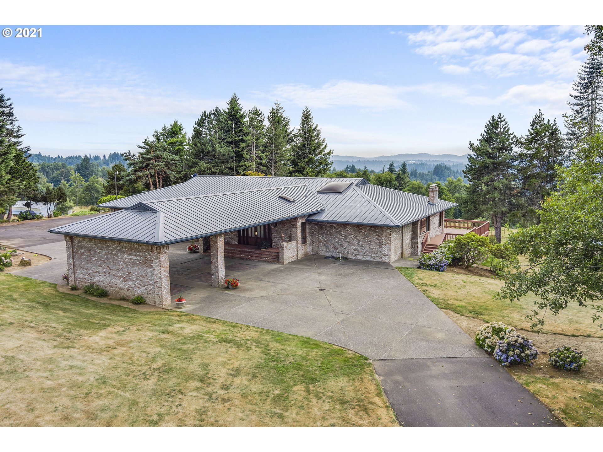 201 Northeast Salzman Road Corbett, OR 97019 - Photo 2 of 32 a view of a house with a patio