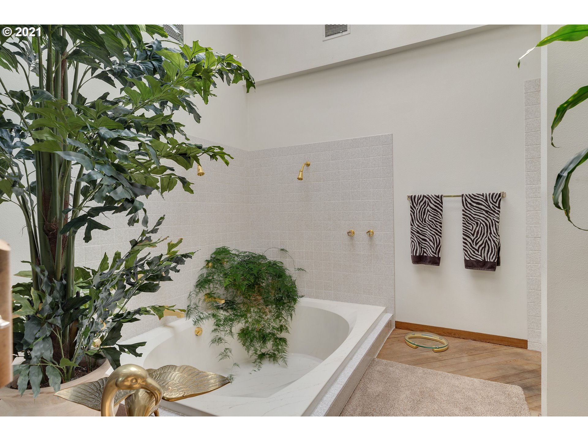 201 Northeast Salzman Road Corbett, OR 97019 - Photo 17 of 32 a bathroom with a bathtub and a plant