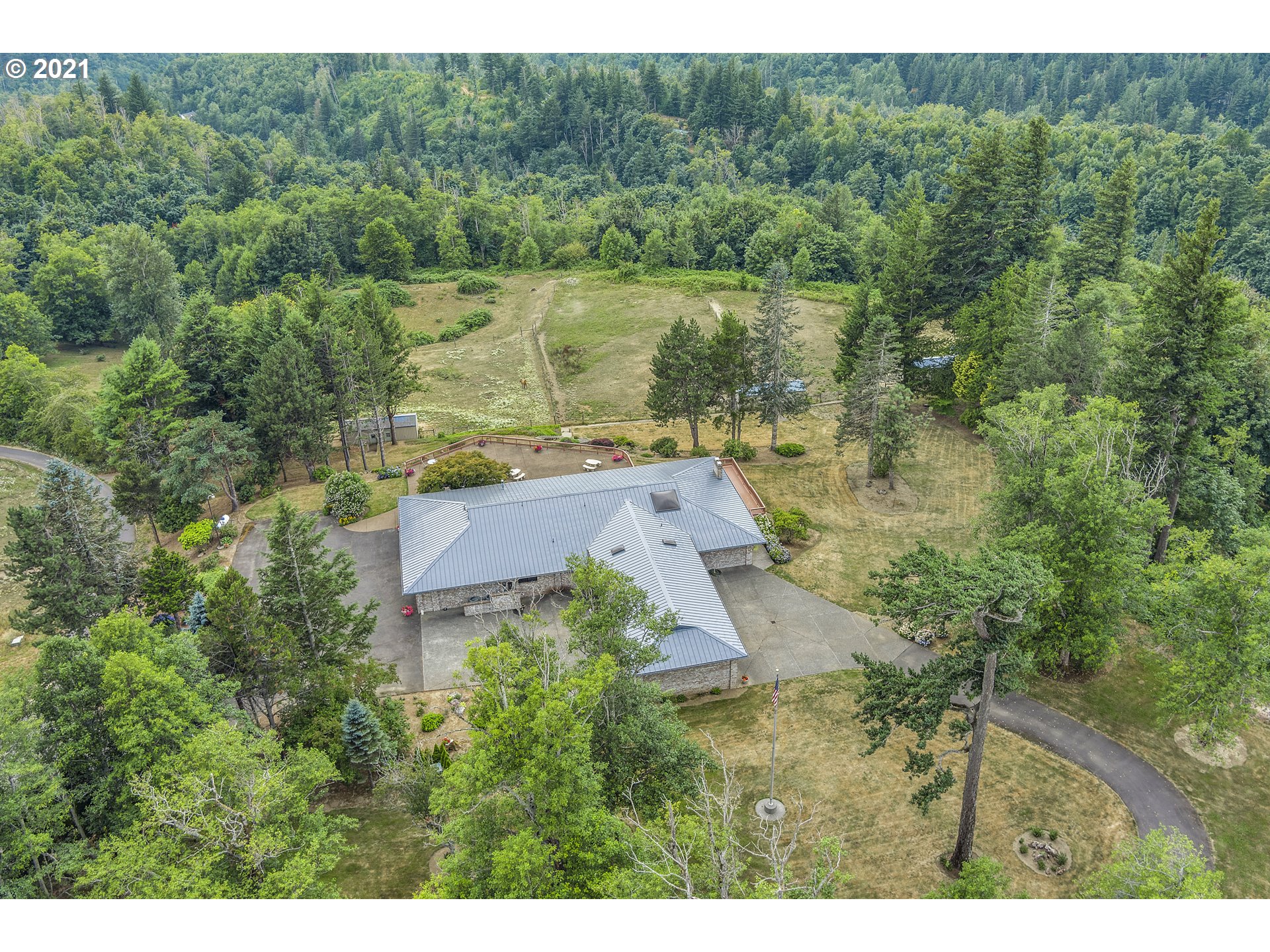 201 Northeast Salzman Road Corbett, OR 97019 - Photo 3 of 32 a view of a lake with a yard