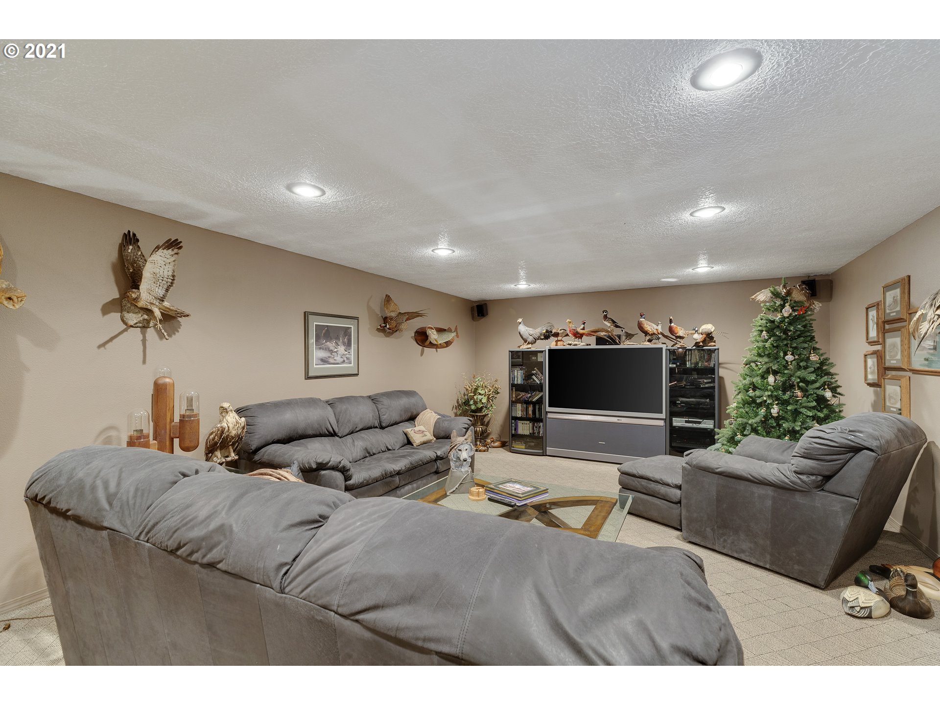201 Northeast Salzman Road Corbett, OR 97019 - Photo 21 of 32 a living room with furniture and a flat screen tv