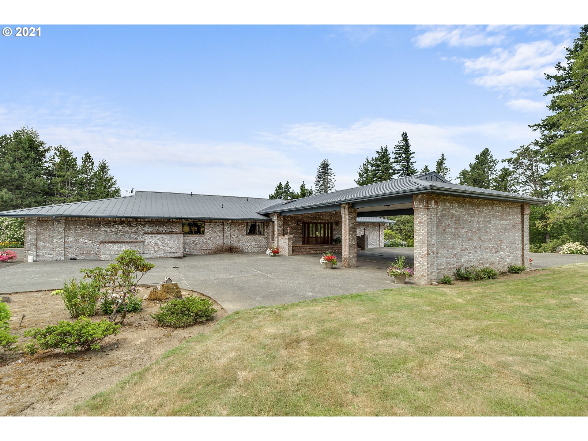 201 Northeast Salzman Road Corbett, OR 97019 - Photo 23 of 32 a front view of a house with a garden