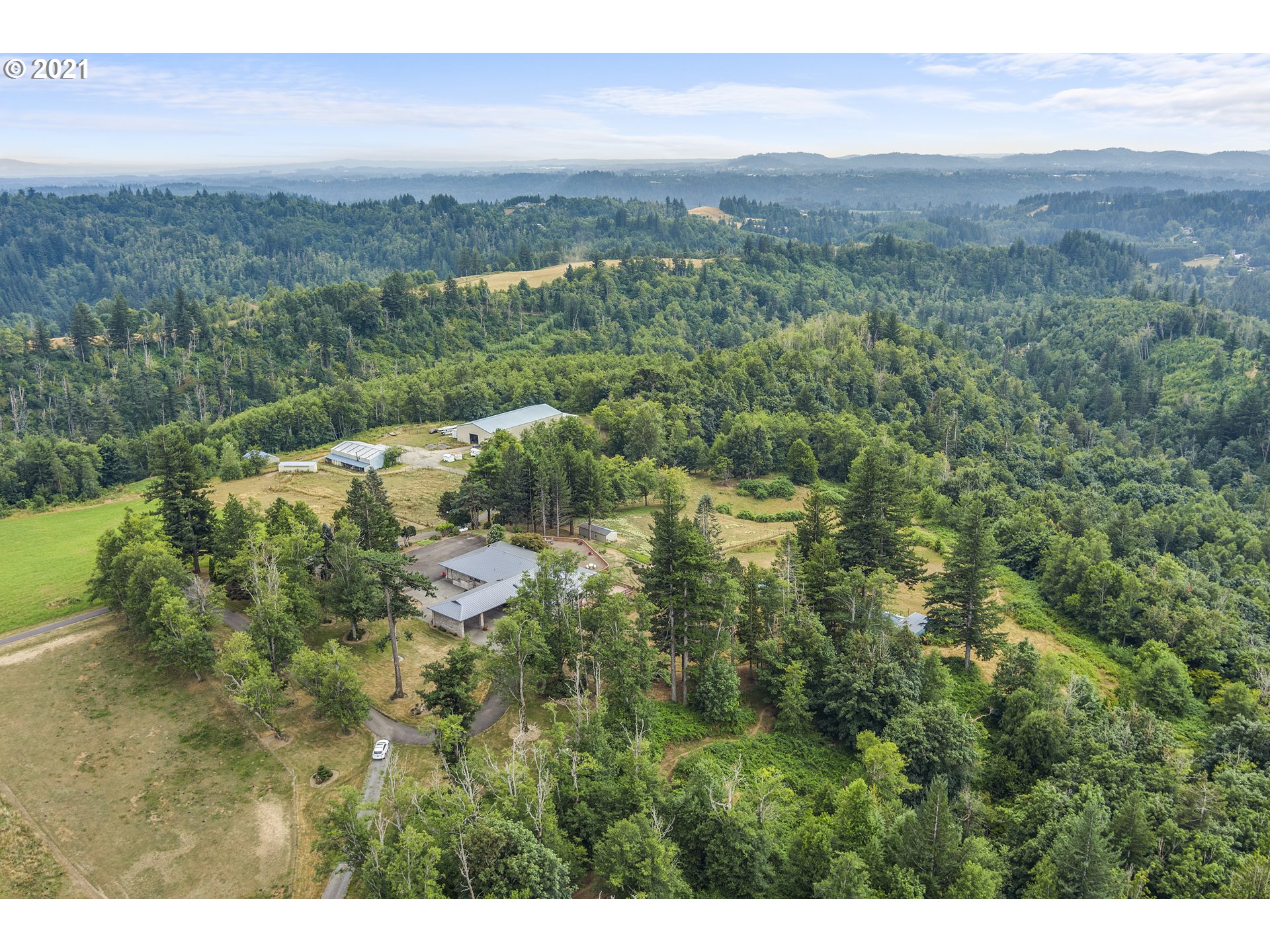 201 Northeast Salzman Road Corbett, OR 97019 - Photo 5 of 32 a view of a city with lush green forest