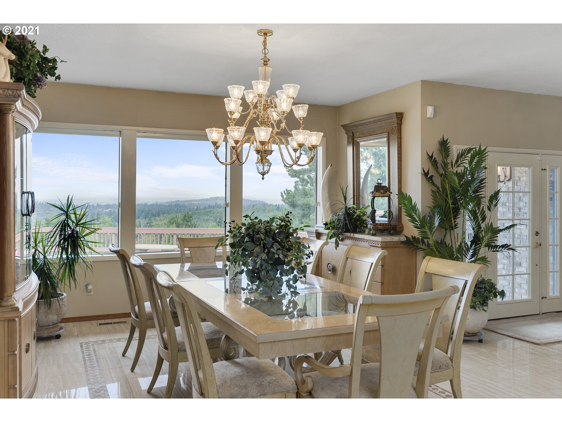 201 Northeast Salzman Road Corbett, OR 97019 - Photo 8 of 32 a dining room with furniture potted plants and wooden floor
