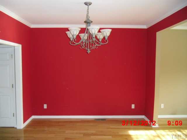 12200 Fox Valley Street Raleigh, NC 27614 - Photo 4 of 8 a view of a room with red wall and window
