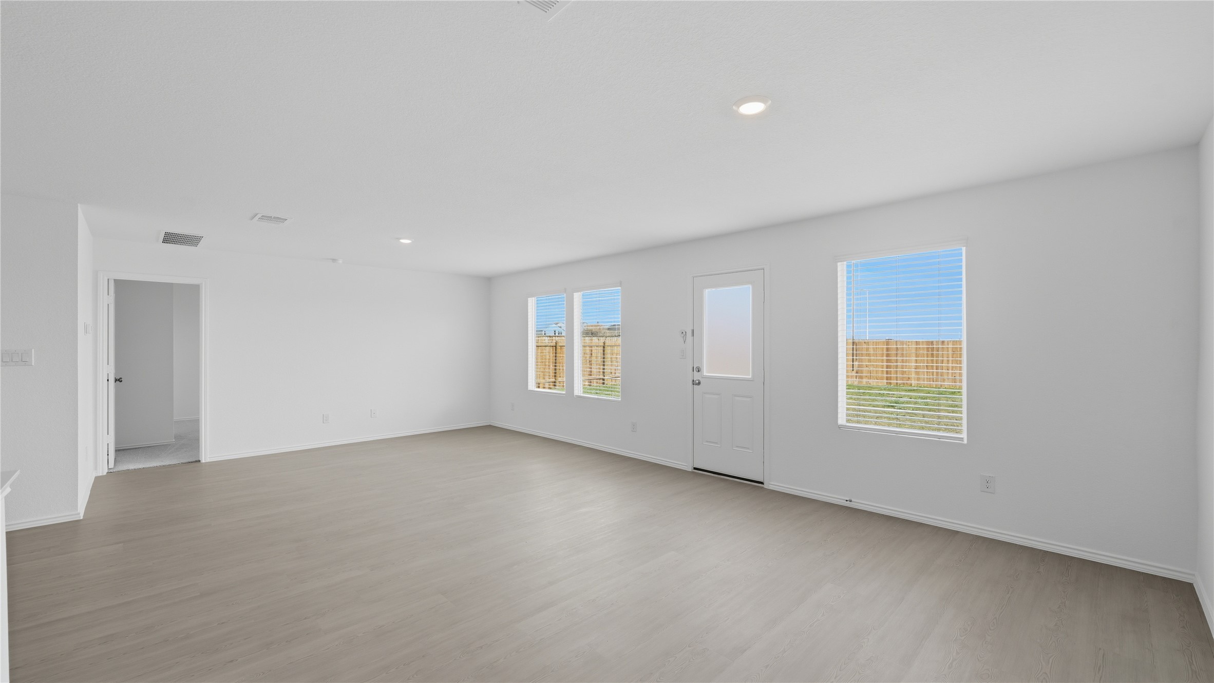 221 Stumpy Street San Marcos, TX 78666 - Photo 11 of 35 an empty room with windows